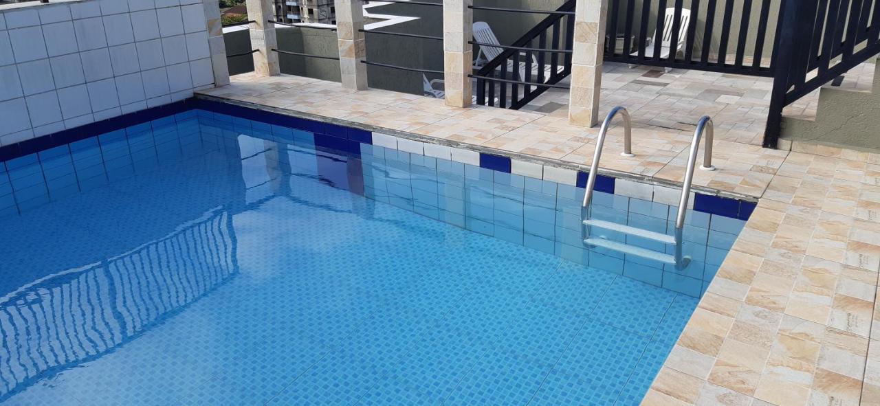Apartment Guarujá: Beachside Retreat With Pool And Flexible Check-in Guaruja